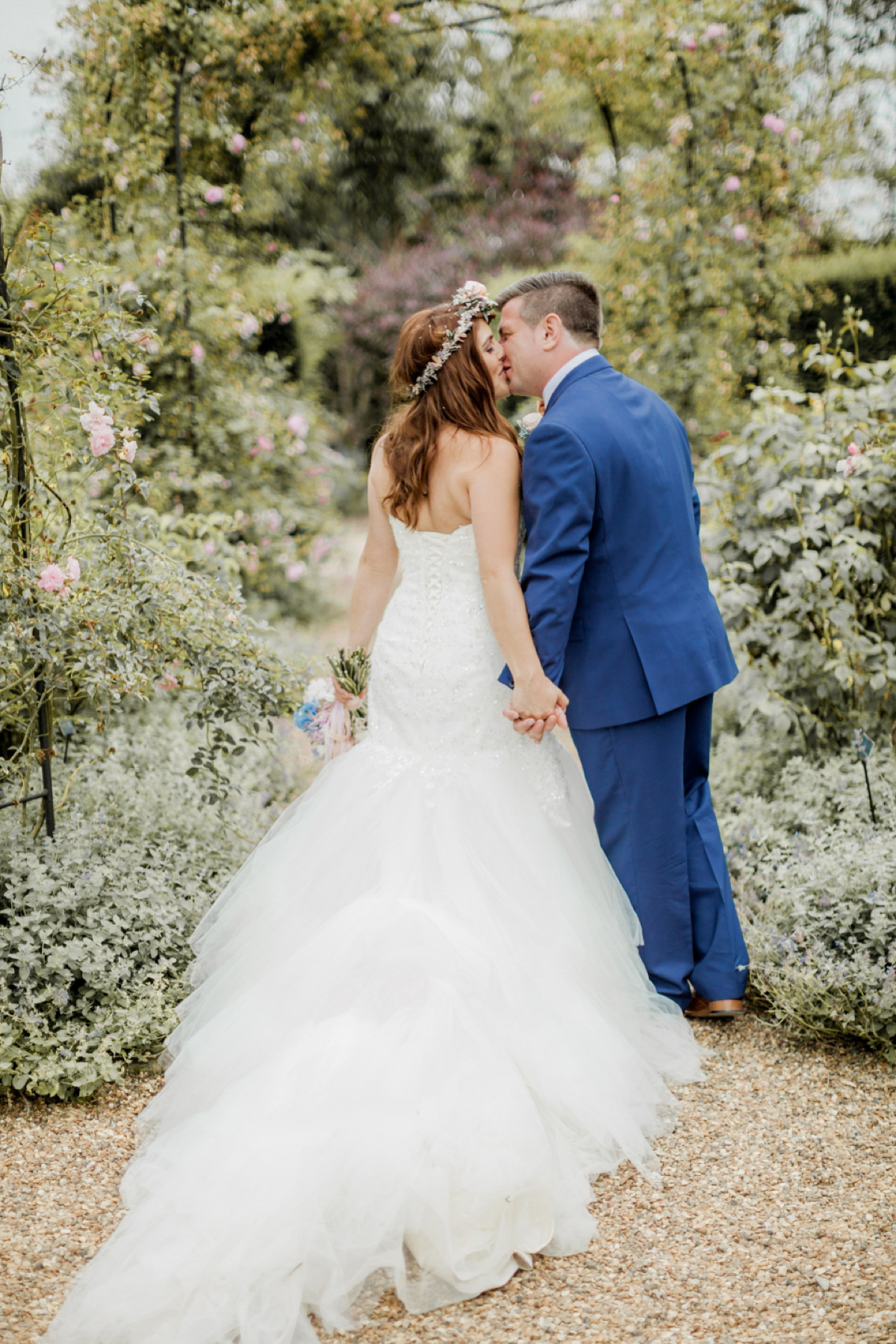 Maggie Sottero for a flower filled country garden wedding. Photography by Naomi Kenton.