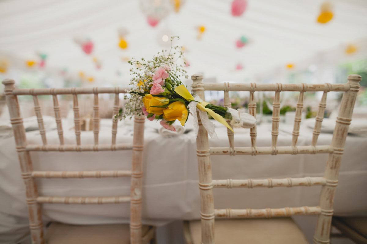 Bride Leah wears a Watters gown for her romantic and pretty English country garden wedding. Photography by Sally T.