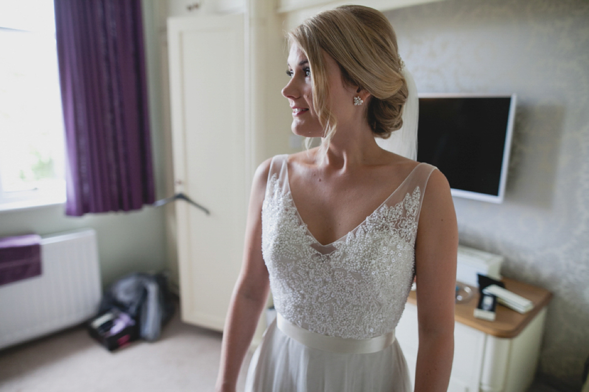 Bride Leah wears a Watters gown for her romantic and pretty English country garden wedding. Photography by Sally T.