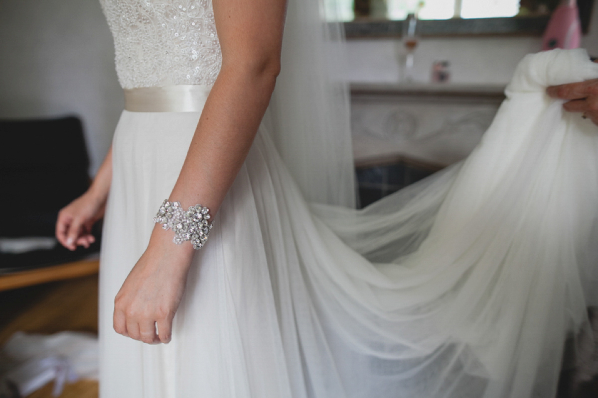 Bride Leah wears a Watters gown for her romantic and pretty English country garden wedding. Photography by Sally T.