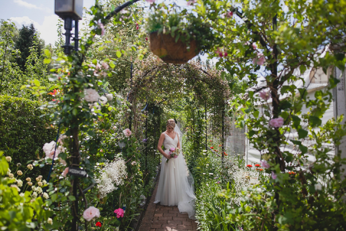 Bride Leah wears a Watters gown for her romantic and pretty English country garden wedding. Photography by Sally T.