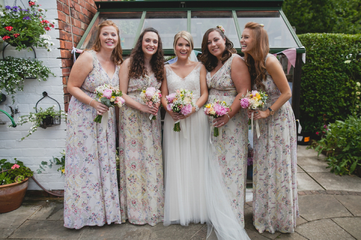 Bride Leah wears a Watters gown for her romantic and pretty English country garden wedding. Photography by Sally T.