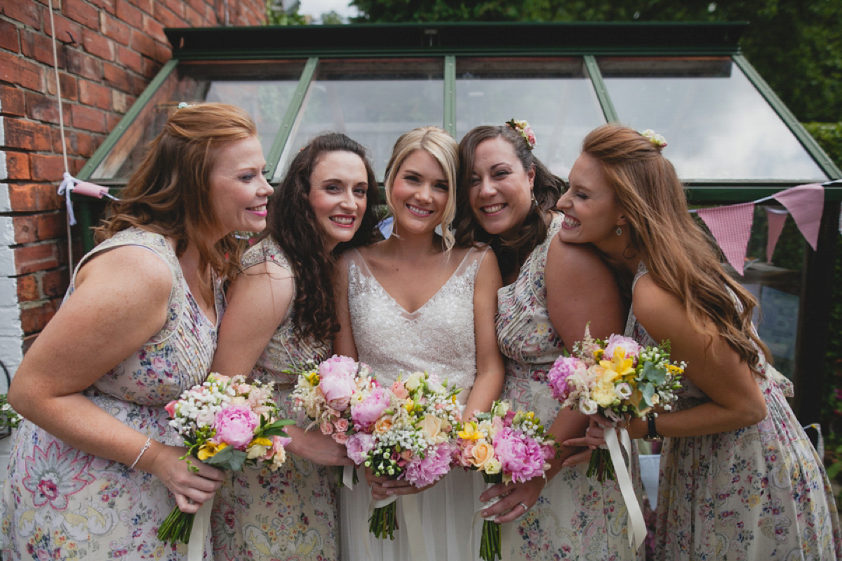 Bride Leah wears a Watters gown for her romantic and pretty English country garden wedding. Photography by Sally T.