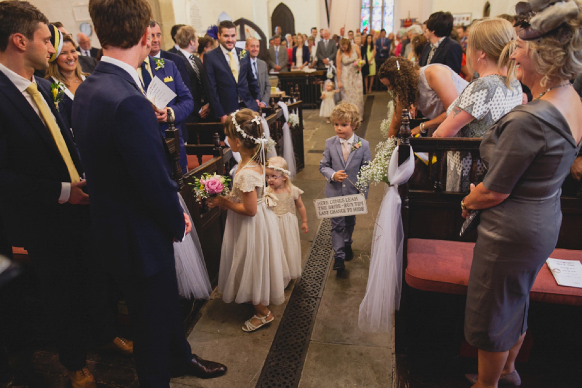 Bride Leah wears a Watters gown for her romantic and pretty English country garden wedding. Photography by Sally T.