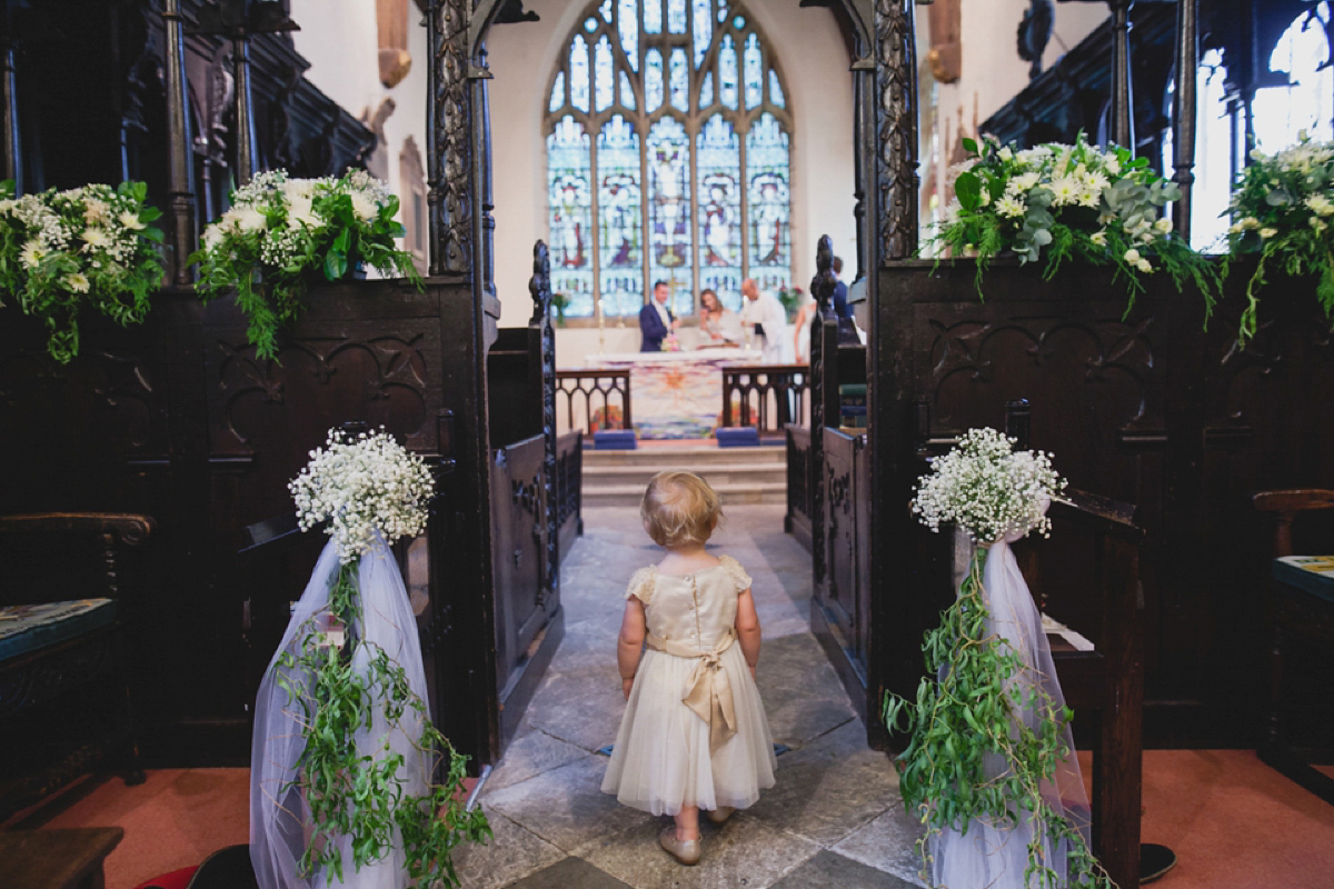 Bride Leah wears a Watters gown for her romantic and pretty English country garden wedding. Photography by Sally T.