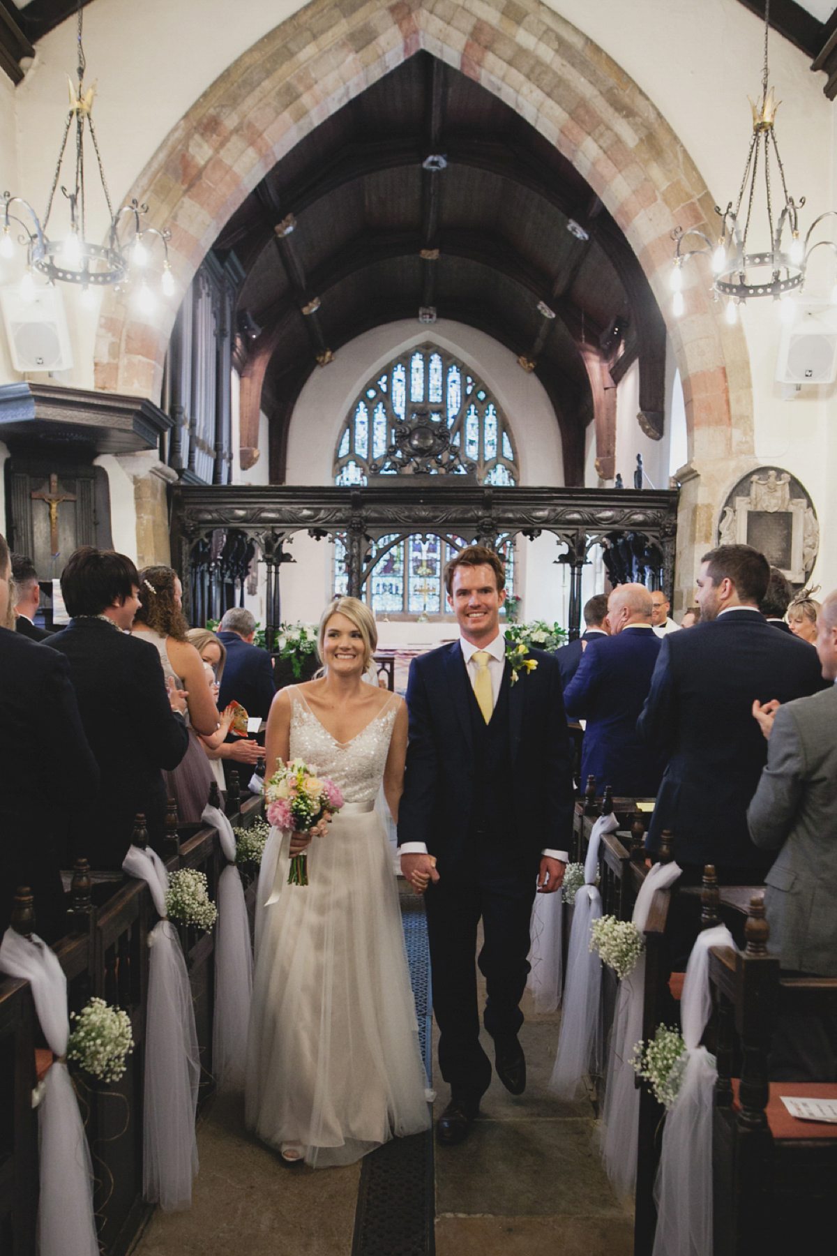 Bride Leah wears a Watters gown for her romantic and pretty English country garden wedding. Photography by Sally T.