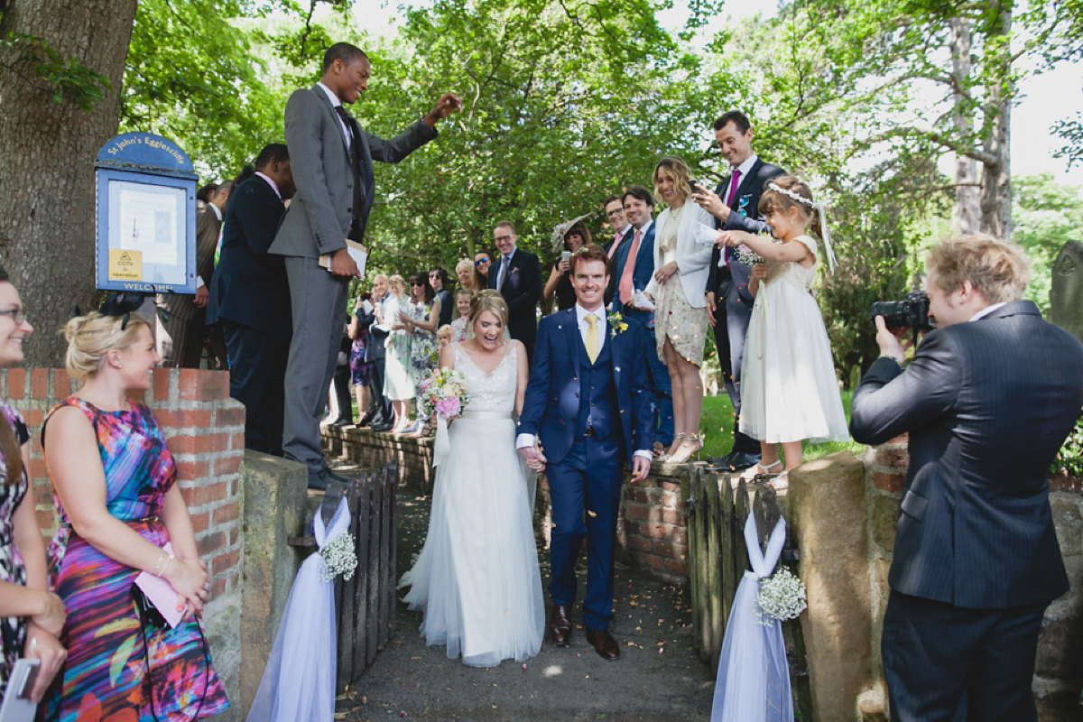 Bride Leah wears a Watters gown for her romantic and pretty English country garden wedding. Photography by Sally T.