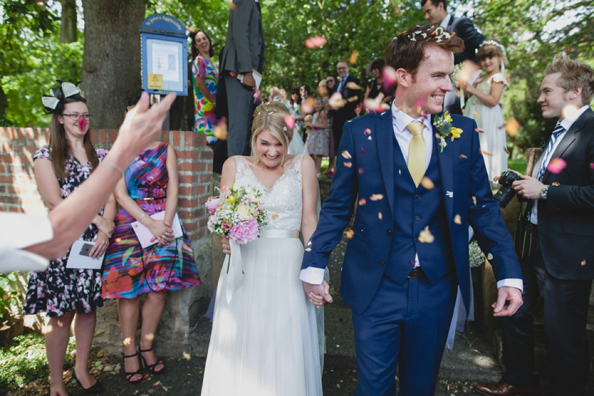 Bride Leah wears a Watters gown for her romantic and pretty English country garden wedding. Photography by Sally T.