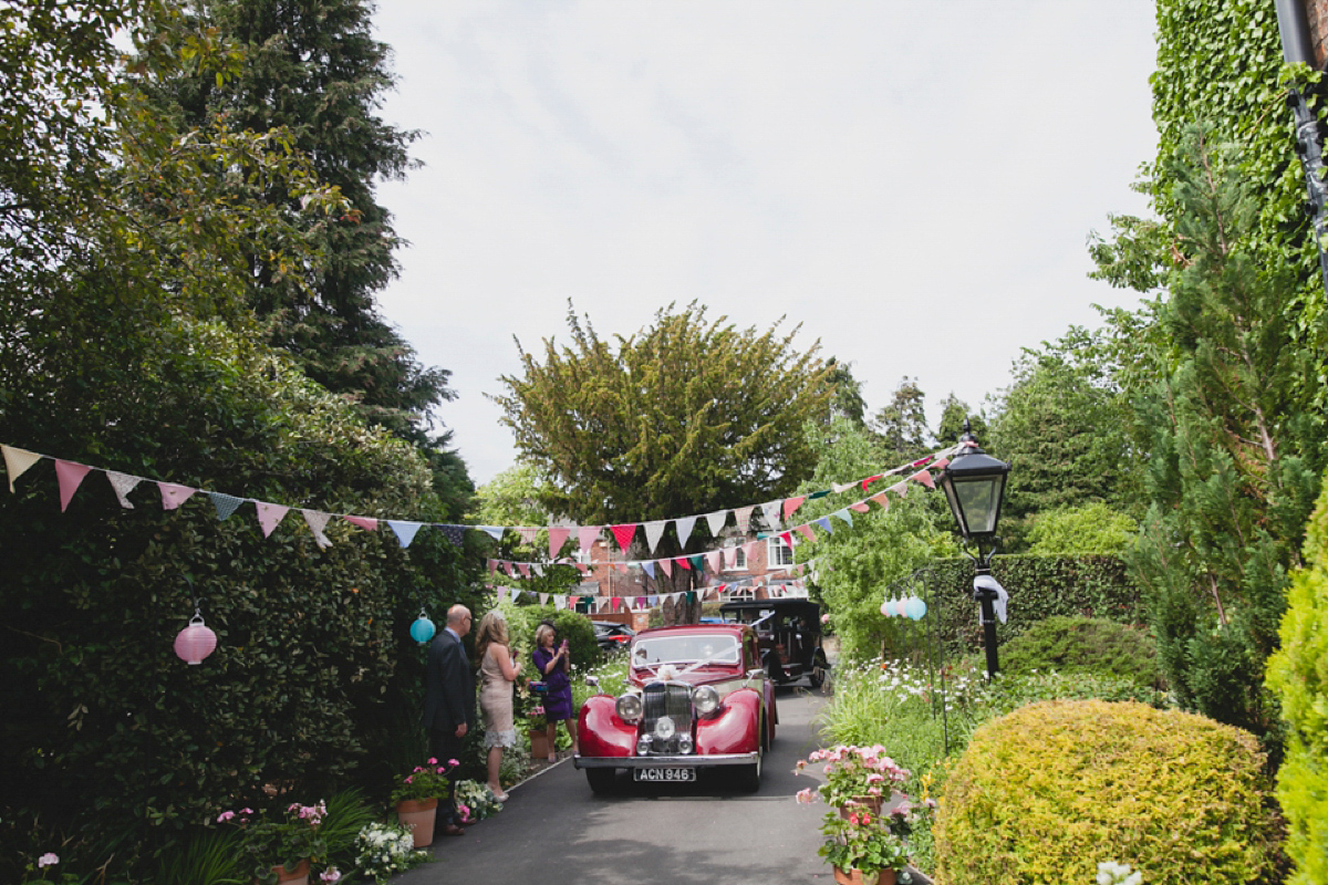 Bride Leah wears a Watters gown for her romantic and pretty English country garden wedding. Photography by Sally T.