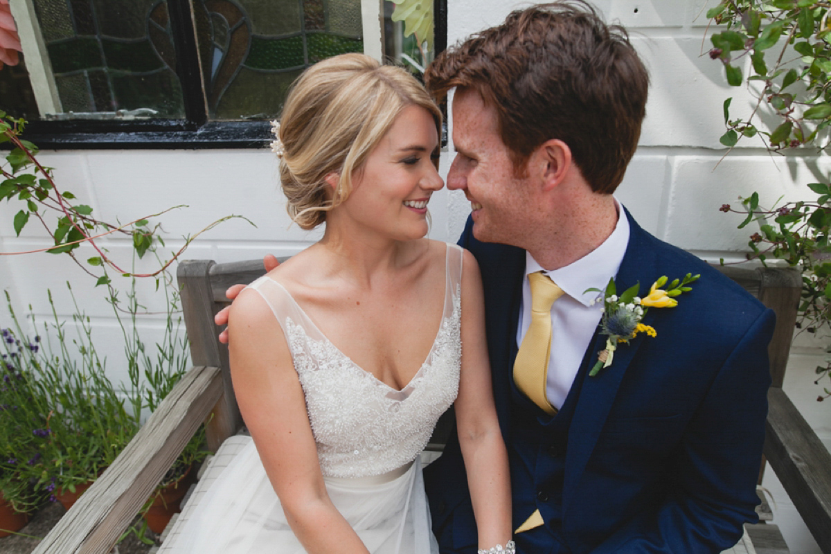 Bride Leah wears a Watters gown for her romantic and pretty English country garden wedding. Photography by Sally T.