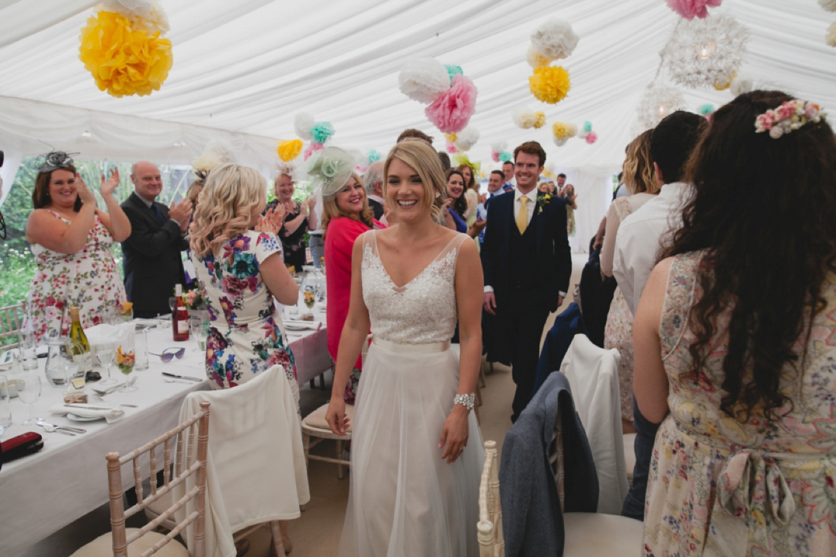 Bride Leah wears a Watters gown for her romantic and pretty English country garden wedding. Photography by Sally T.