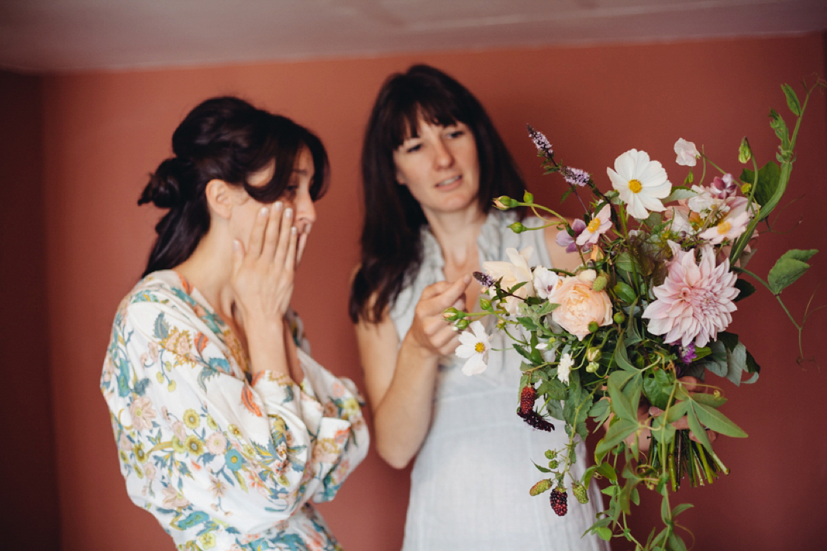 A backless Charlie Brear gown for a festival style tipi wedding in Cornwall. Photography by Lucy Little.