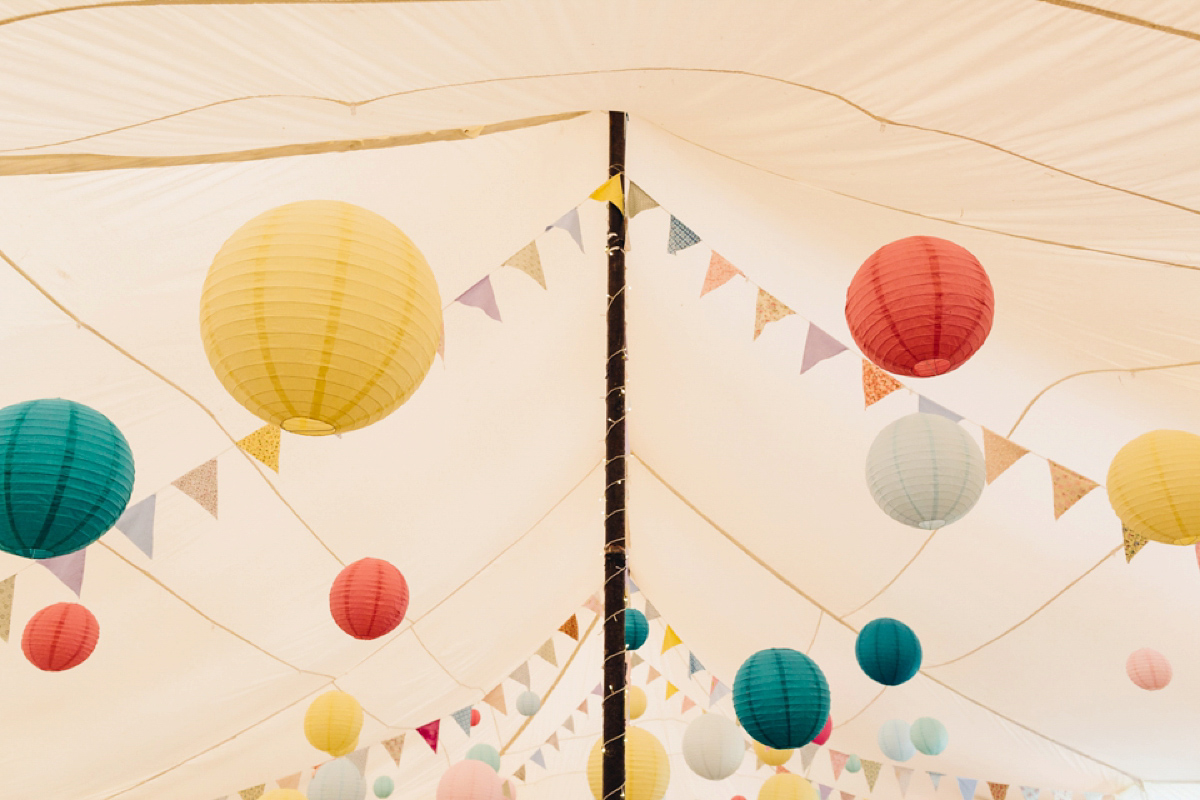 A backless Charlie Brear gown for a festival style tipi wedding in Cornwall. Photography by Lucy Little.