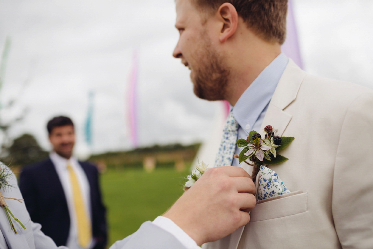 A backless Charlie Brear gown for a festival style tipi wedding in Cornwall. Photography by Lucy Little.