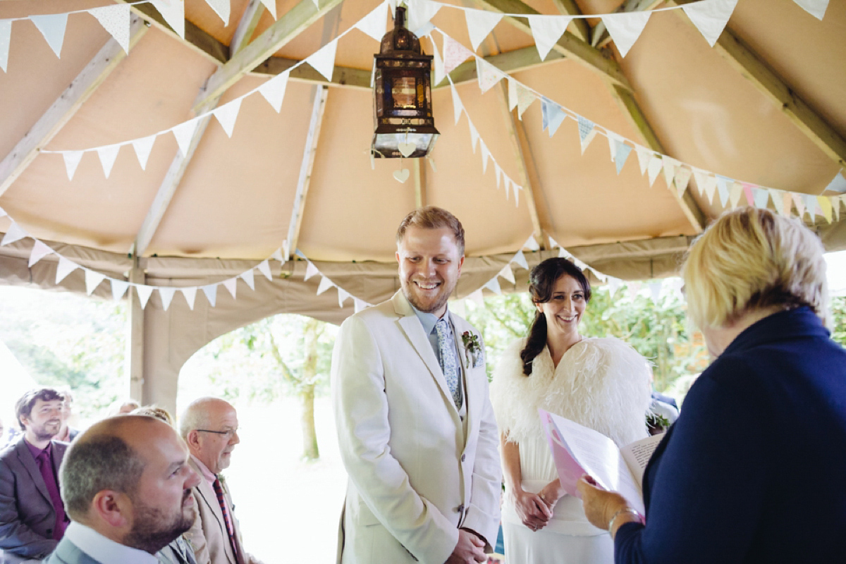 A backless Charlie Brear gown for a festival style tipi wedding in Cornwall. Photography by Lucy Little.