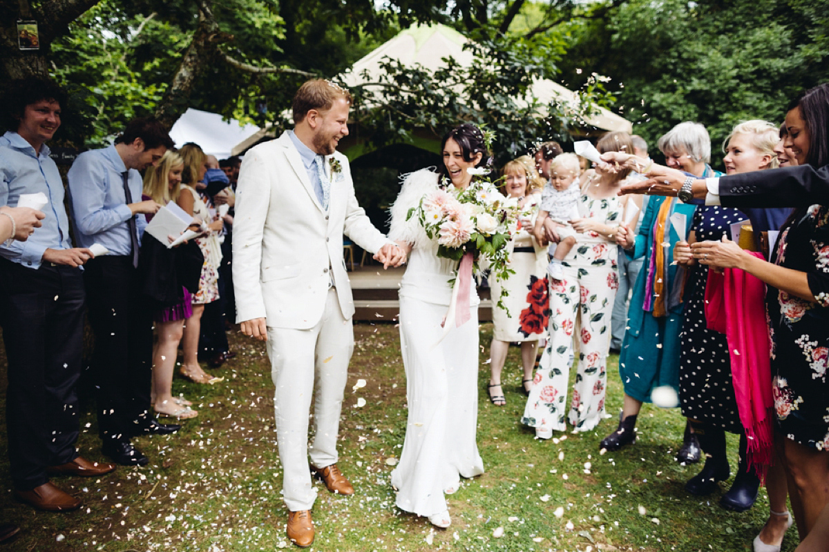 A backless Charlie Brear gown for a festival style tipi wedding in Cornwall. Photography by Lucy Little.