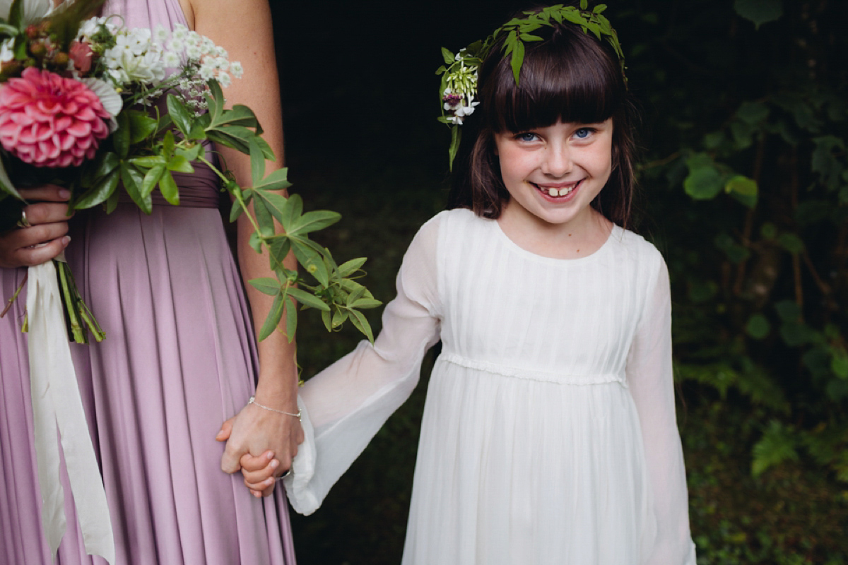 A backless Charlie Brear gown for a festival style tipi wedding in Cornwall. Photography by Lucy Little.