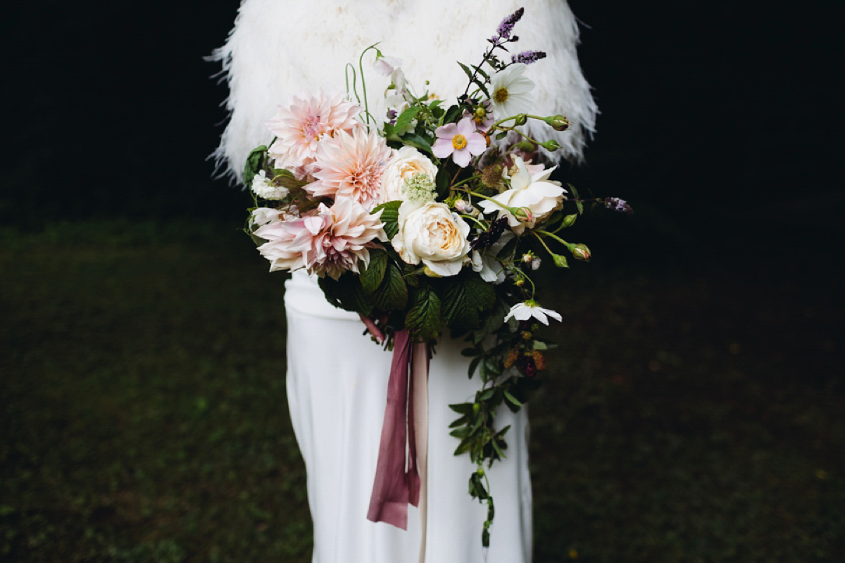 A backless Charlie Brear gown for a festival style tipi wedding in Cornwall. Photography by Lucy Little.