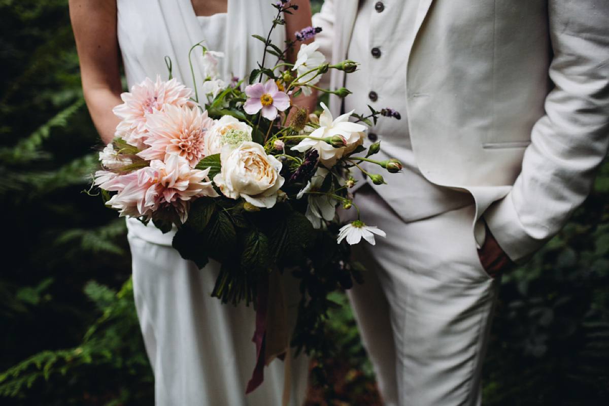 A backless Charlie Brear gown for a festival style tipi wedding in Cornwall. Photography by Lucy Little.