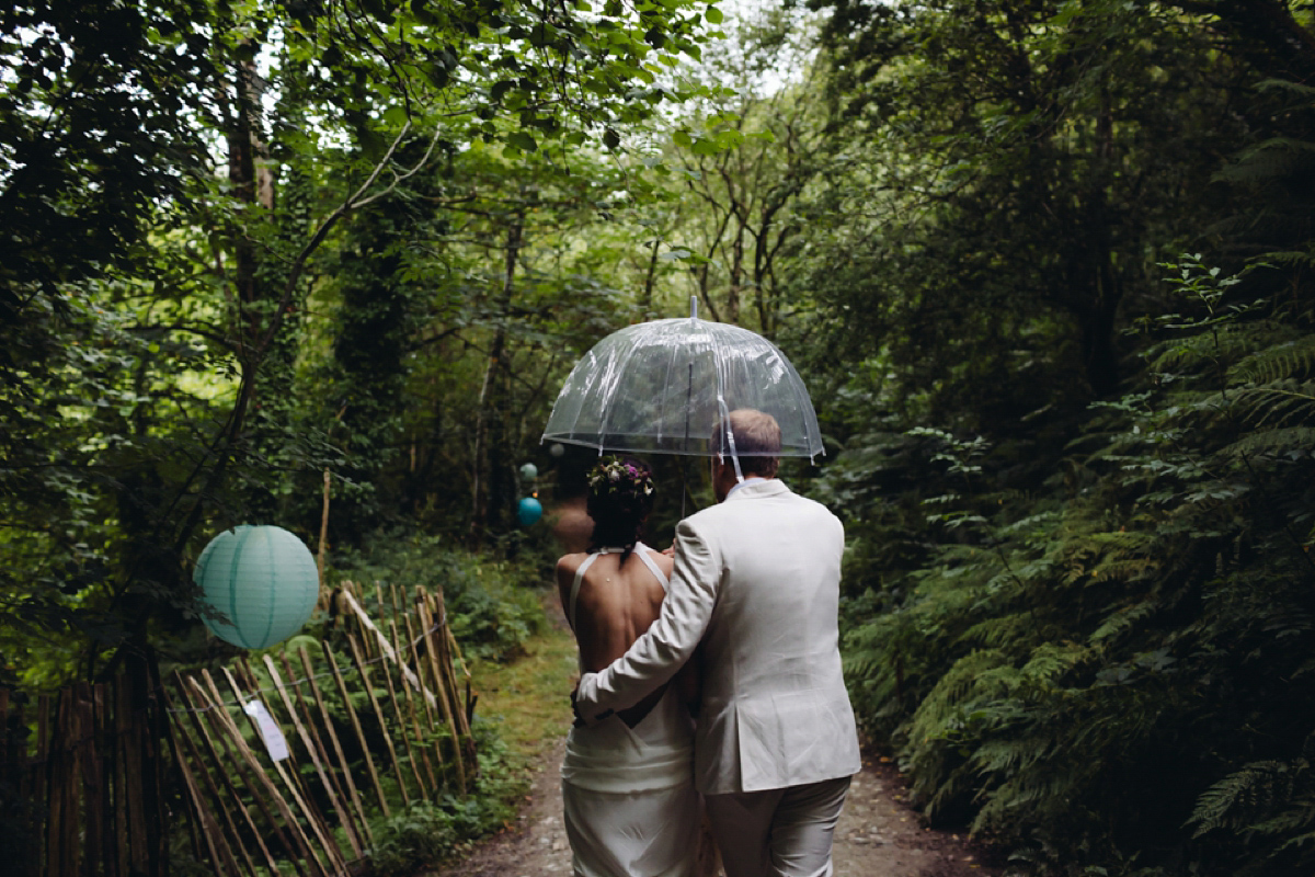 A backless Charlie Brear gown for a festival style tipi wedding in Cornwall. Photography by Lucy Little.