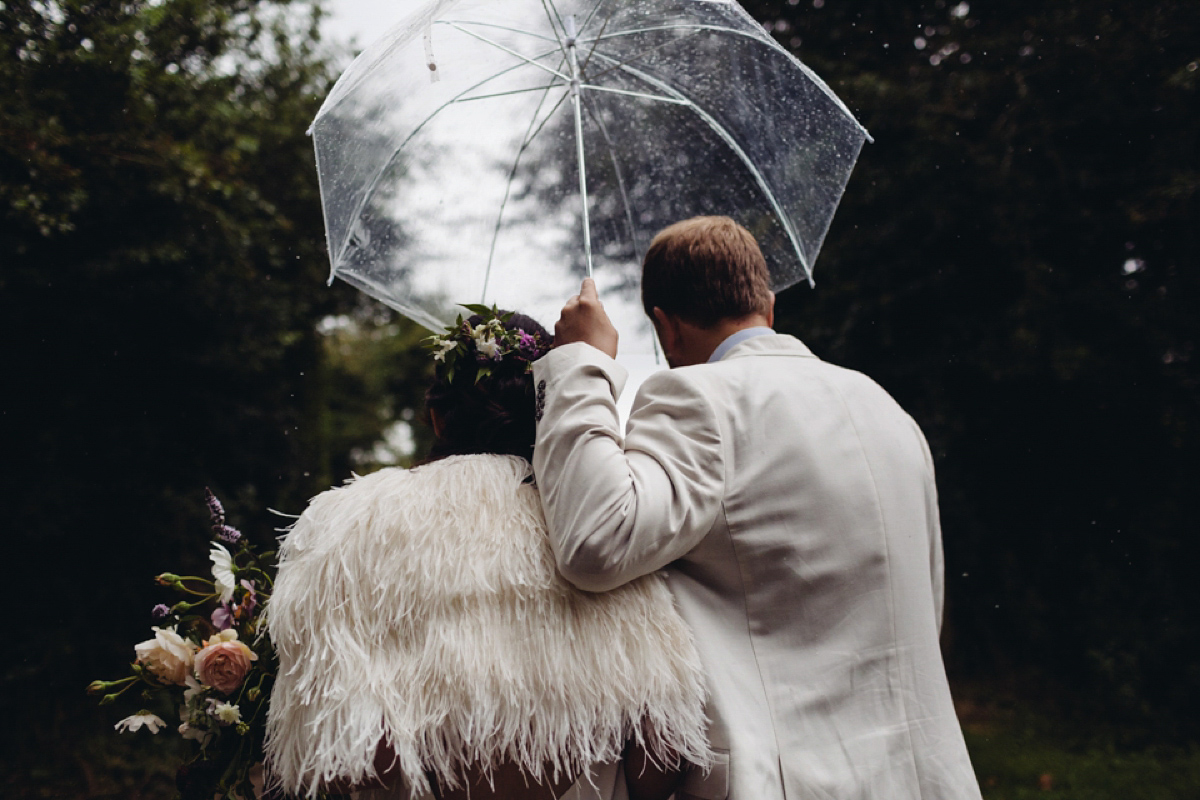 A backless Charlie Brear gown for a festival style tipi wedding in Cornwall. Photography by Lucy Little.