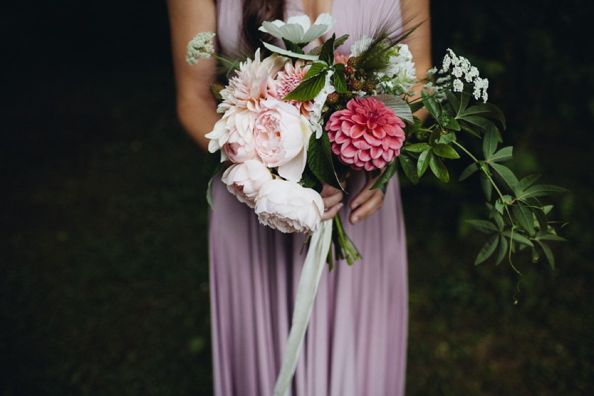 A backless Charlie Brear gown for a festival style tipi wedding in Cornwall. Photography by Lucy Little.