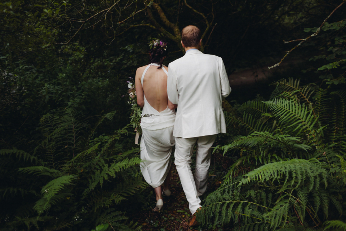 A backless Charlie Brear gown for a festival style tipi wedding in Cornwall. Photography by Lucy Little.