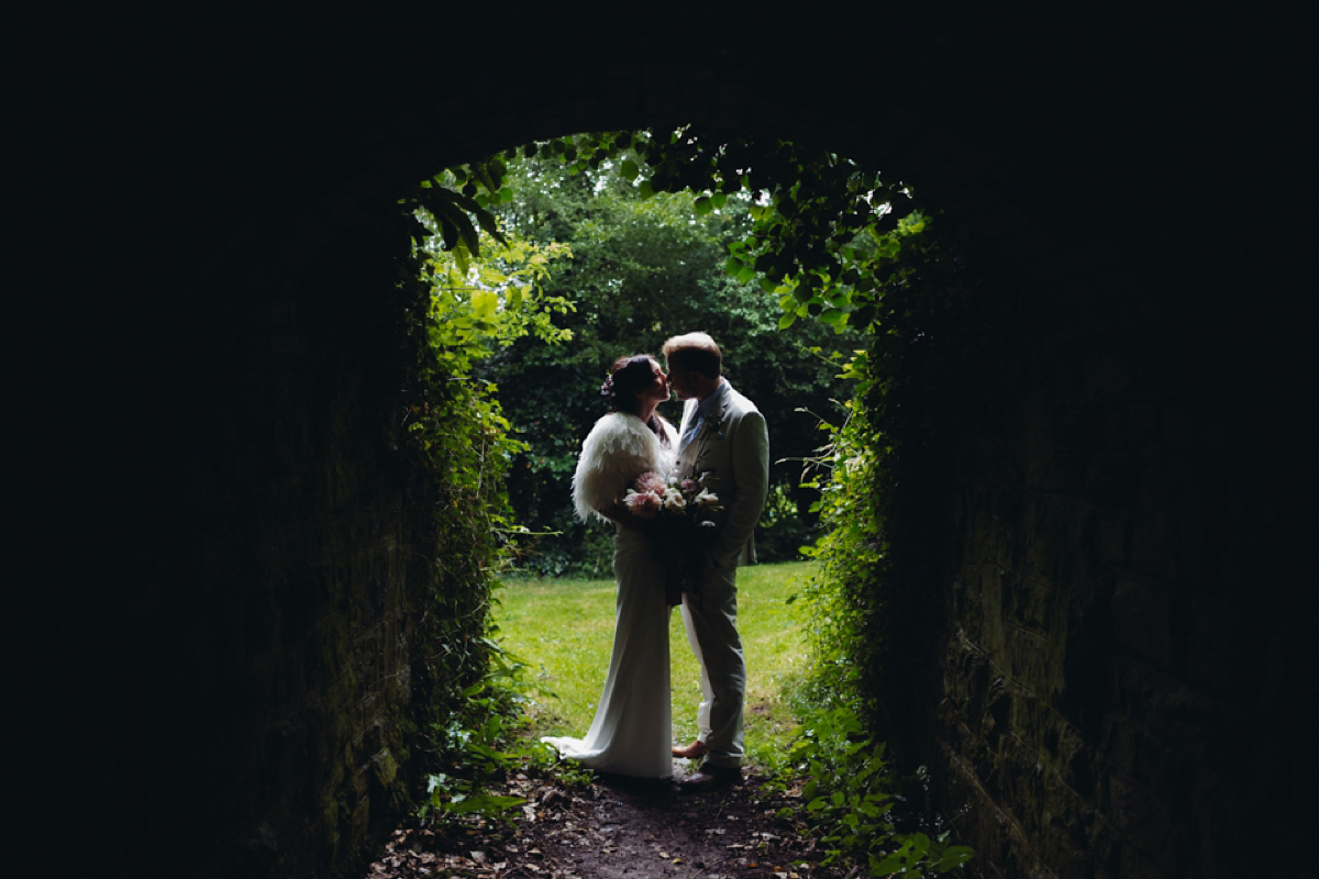 A backless Charlie Brear gown for a festival style tipi wedding in Cornwall. Photography by Lucy Little.