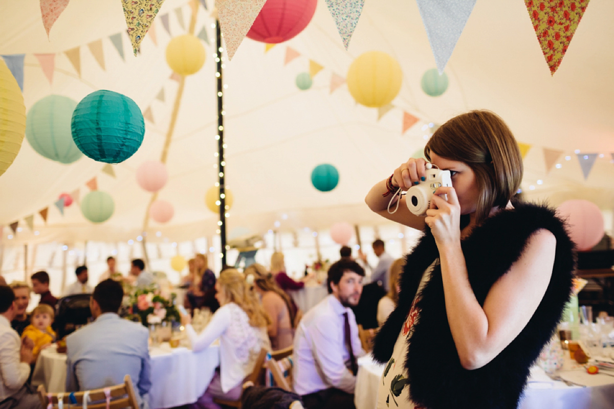 A backless Charlie Brear gown for a festival style tipi wedding in Cornwall. Photography by Lucy Little.