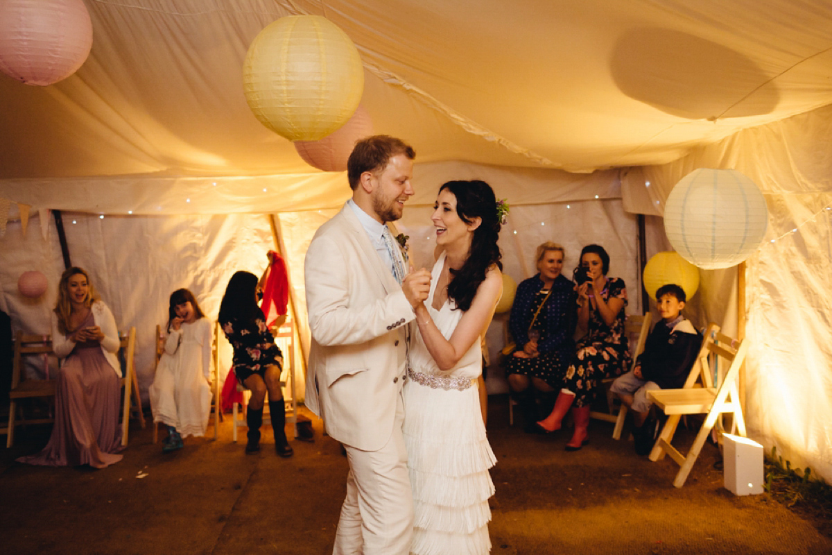A backless Charlie Brear gown for a festival style tipi wedding in Cornwall. Photography by Lucy Little.