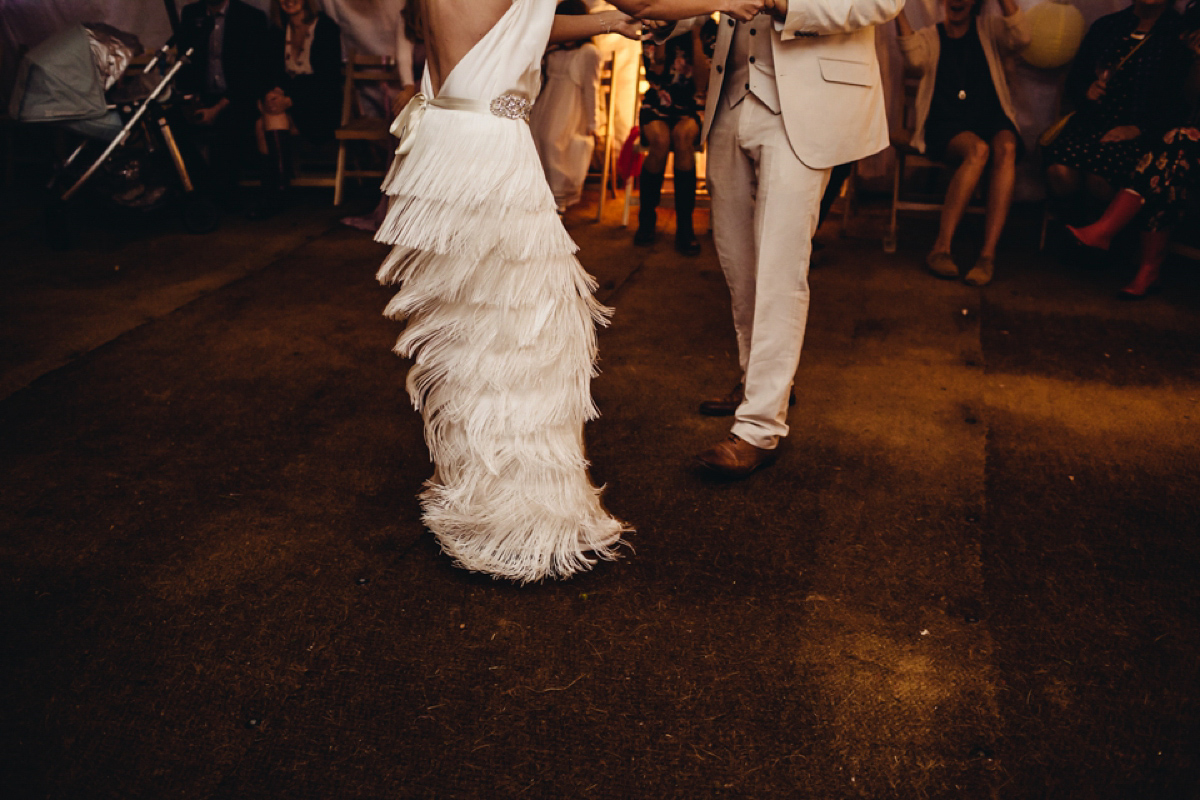 A backless Charlie Brear gown for a festival style tipi wedding in Cornwall. Photography by Lucy Little.