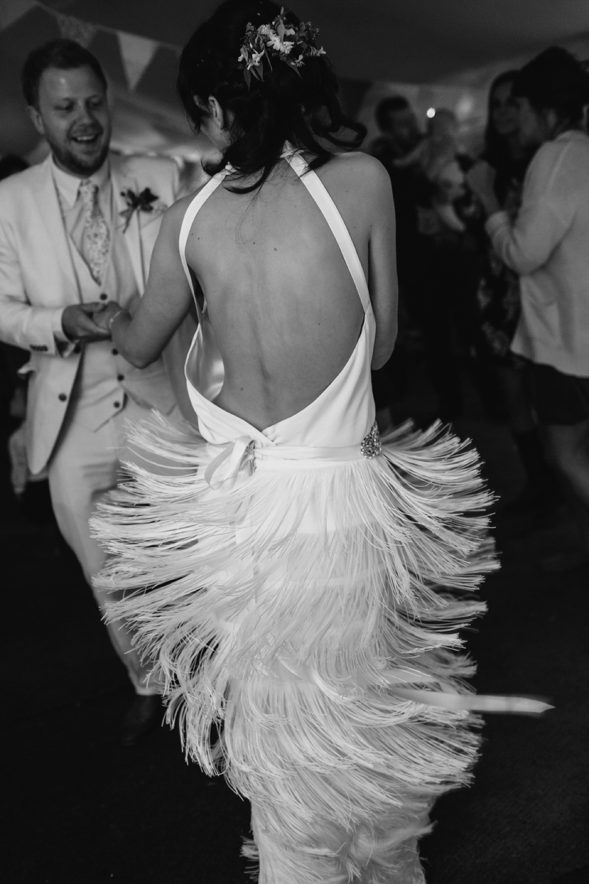 A backless Charlie Brear gown for a festival style tipi wedding in Cornwall. Photography by Lucy Little.