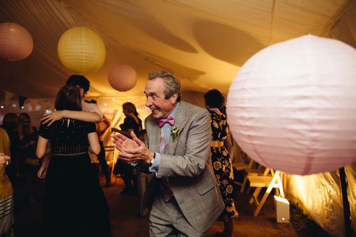 A backless Charlie Brear gown for a festival style tipi wedding in Cornwall. Photography by Lucy Little.