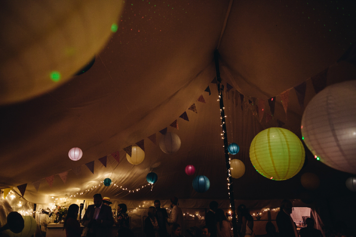 A backless Charlie Brear gown for a festival style tipi wedding in Cornwall. Photography by Lucy Little.