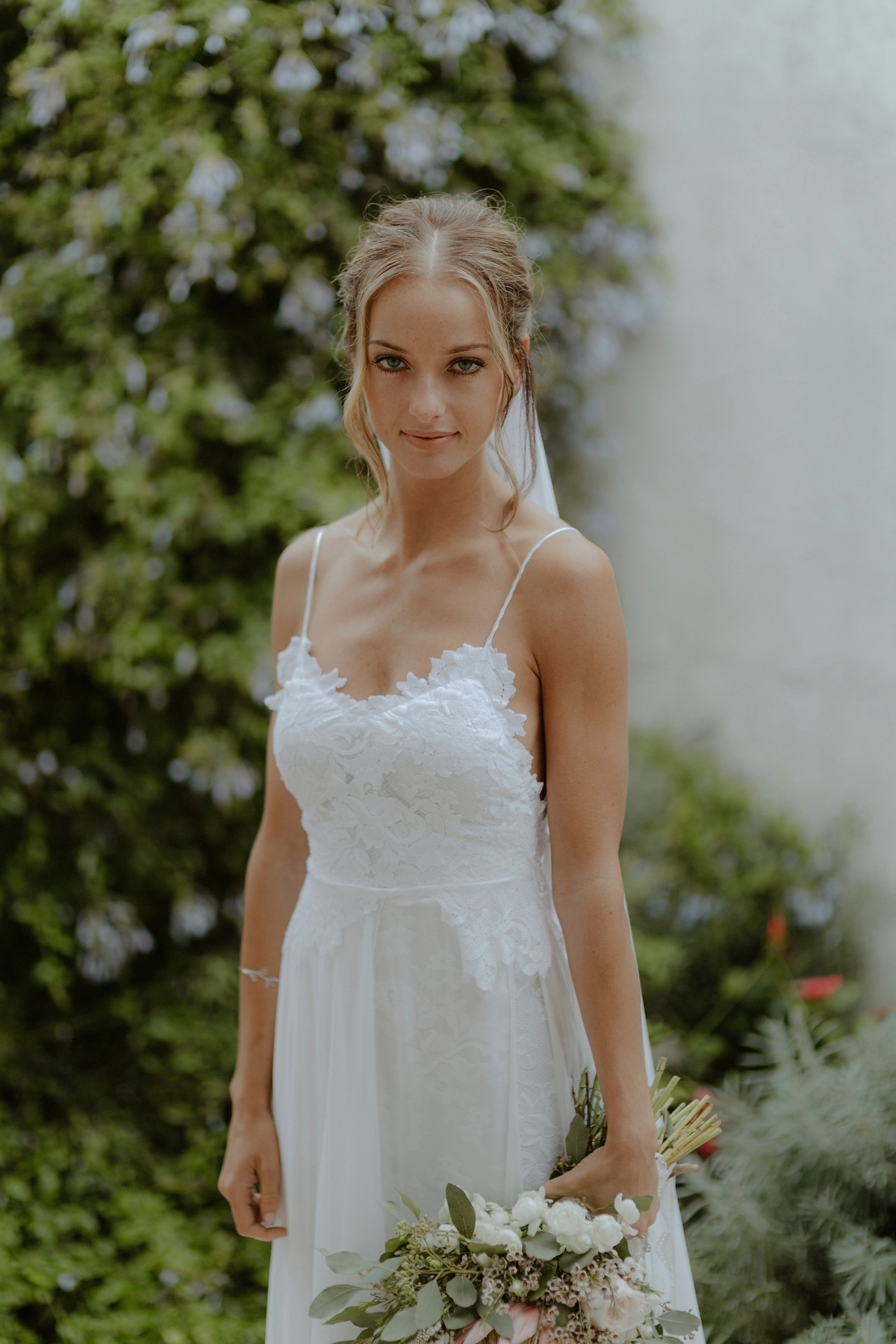 Erica wears a Grace Loves Lace gown for her elegant and bohemian inspired wedding in the south of Italy. Photography by Cinzia Bruschini.