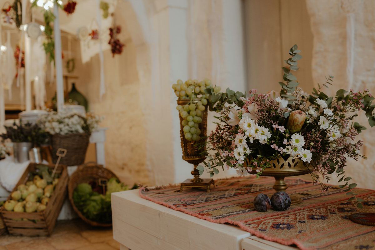 Erica wears a Grace Loves Lace gown for her elegant and bohemian inspired wedding in the south of Italy. Photography by Cinzia Bruschini.