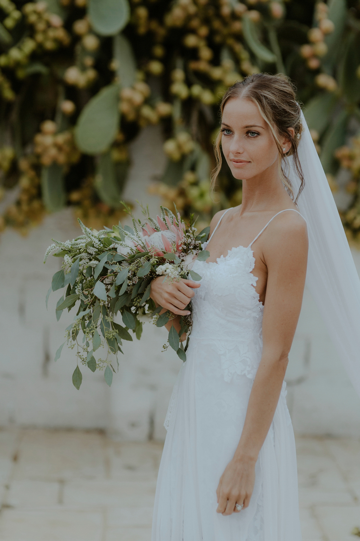 Erica wears a Grace Loves Lace gown for her elegant and bohemian inspired wedding in the south of Italy. Photography by Cinzia Bruschini.