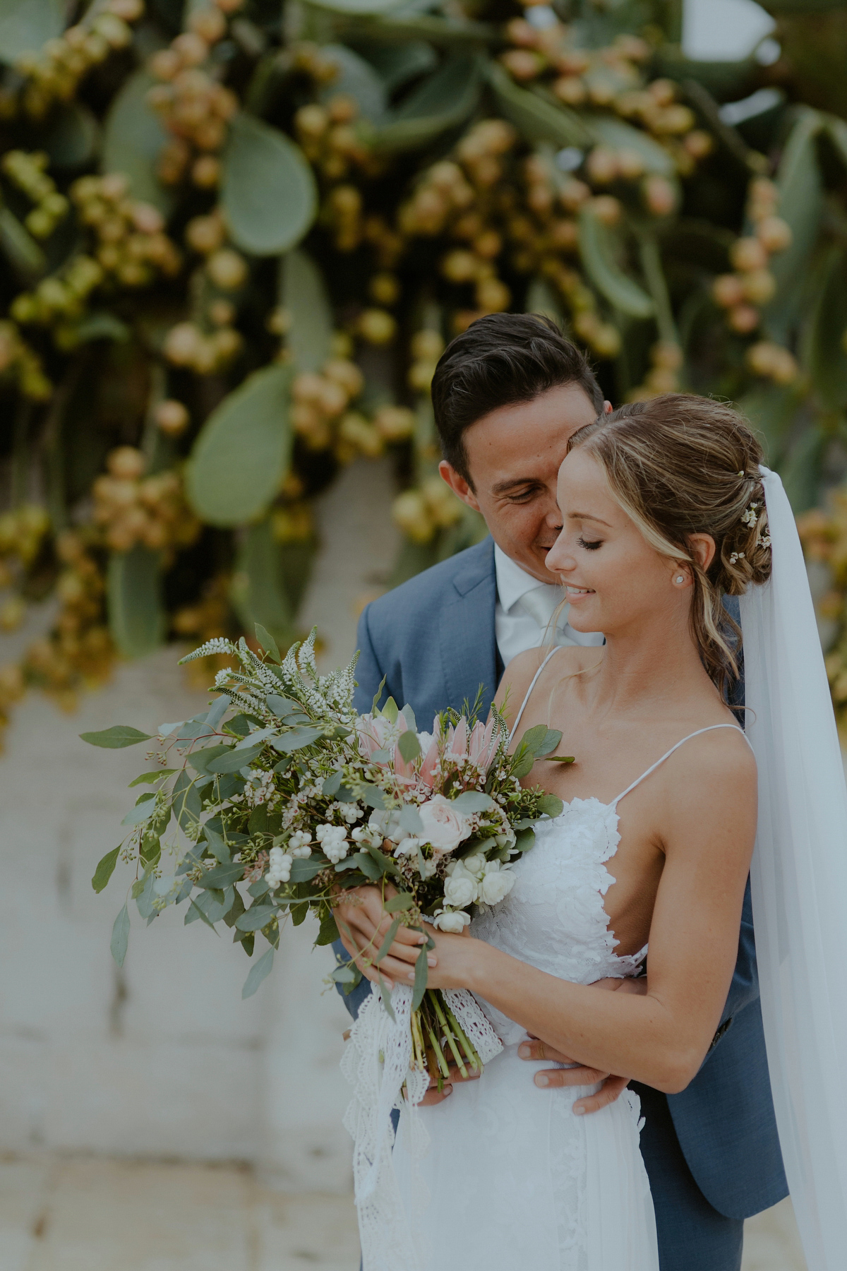 Erica wears a Grace Loves Lace gown for her elegant and bohemian inspired wedding in the south of Italy. Photography by Cinzia Bruschini.