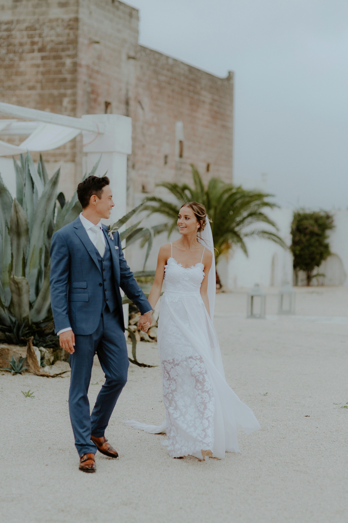 Erica wears a Grace Loves Lace gown for her elegant and bohemian inspired wedding in the south of Italy. Photography by Cinzia Bruschini.