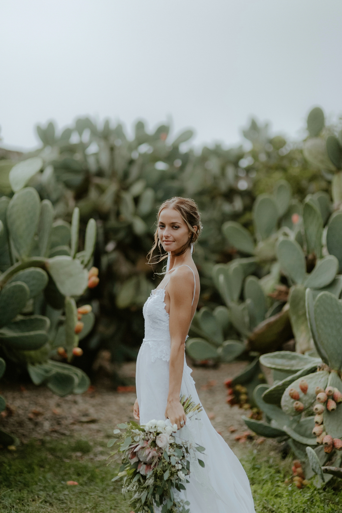 Erica wears a Grace Loves Lace gown for her elegant and bohemian inspired wedding in the south of Italy. Photography by Cinzia Bruschini.