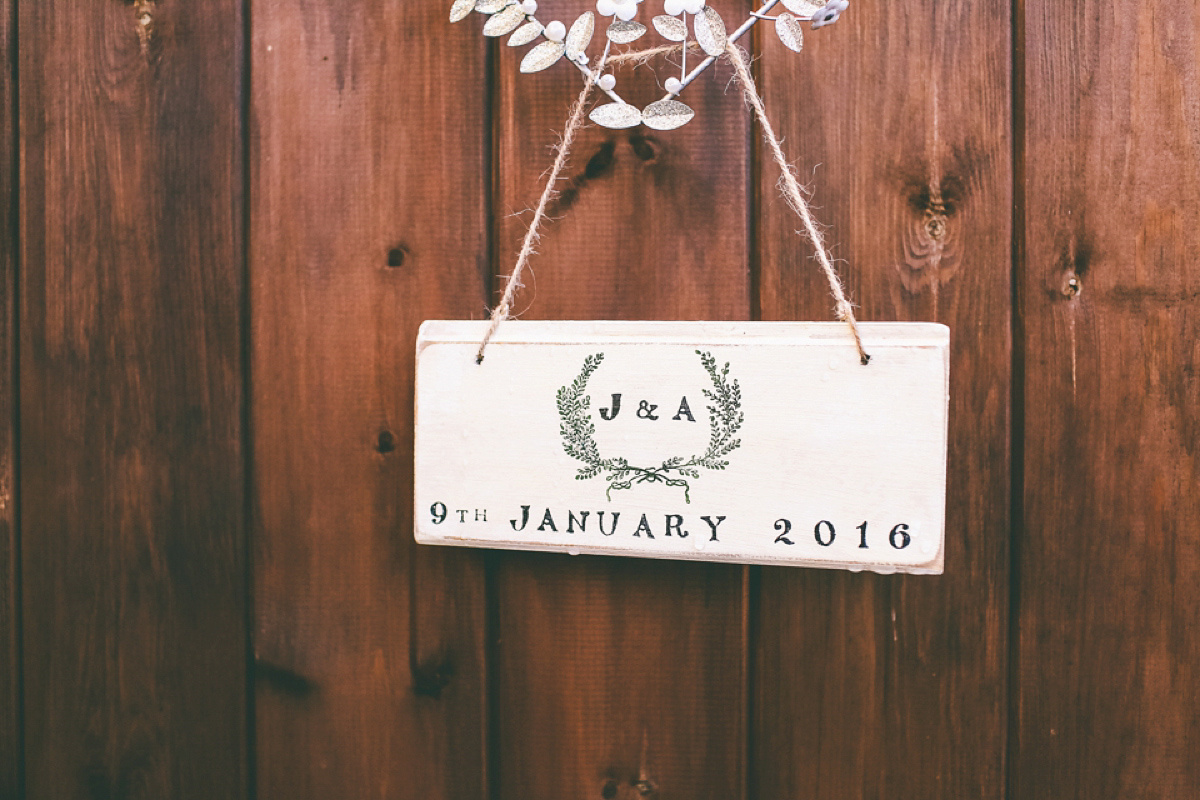 Jess wears an Eliza Jane Howell dress for her winter village hall wedding. Photography by Emma Boileau.