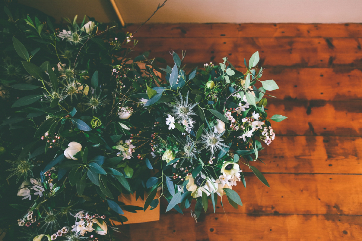 Jess wears an Eliza Jane Howell dress for her winter village hall wedding. Photography by Emma Boileau.