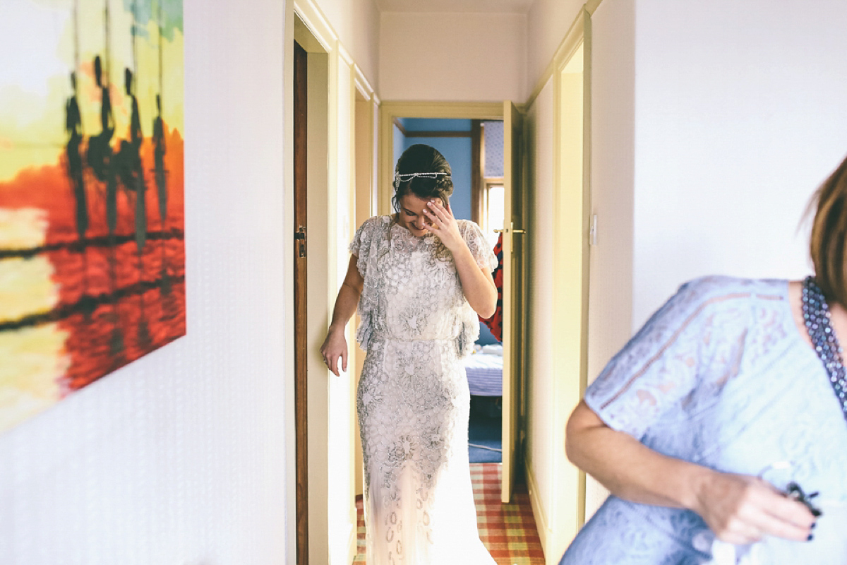 Jess wears an Eliza Jane Howell dress for her winter village hall wedding. Photography by Emma Boileau.