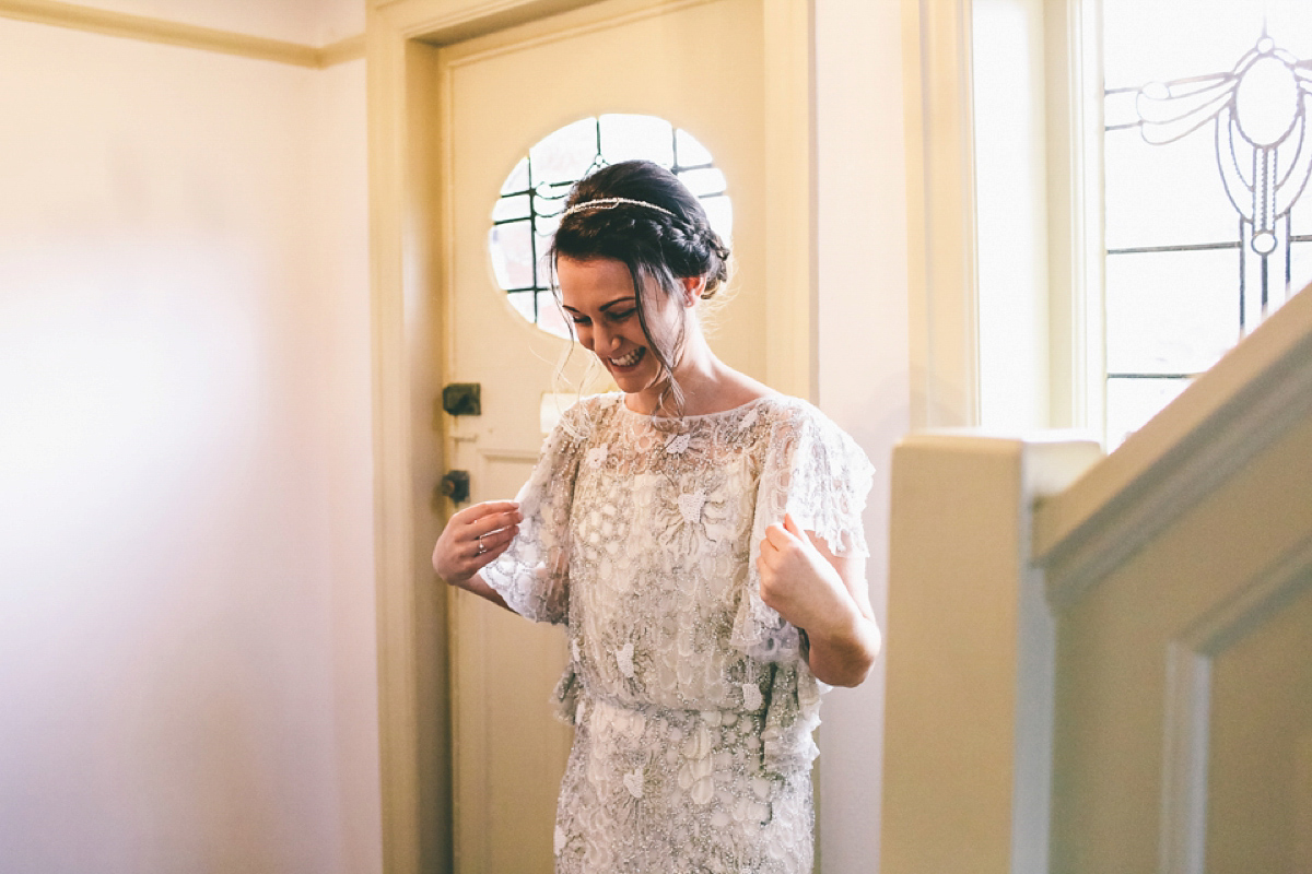 Jess wears an Eliza Jane Howell dress for her winter village hall wedding. Photography by Emma Boileau.