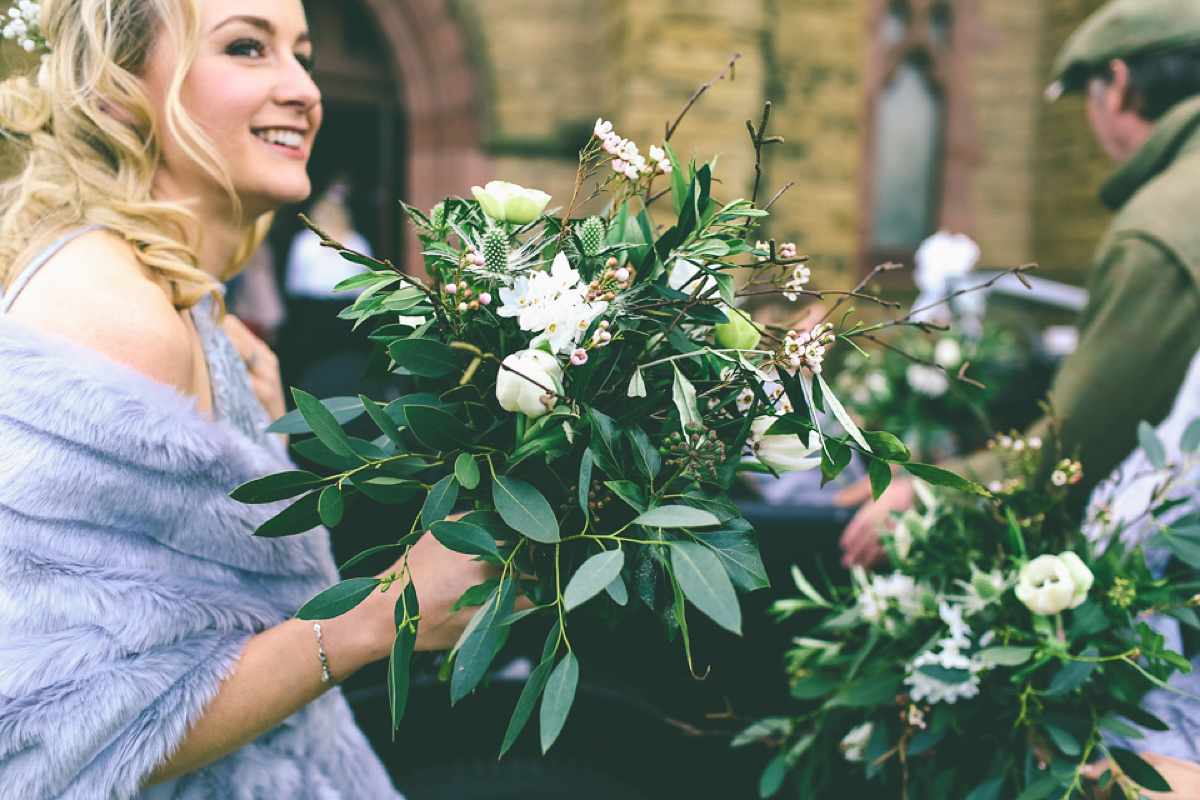 Jess wears an Eliza Jane Howell dress for her winter village hall wedding. Photography by Emma Boileau.