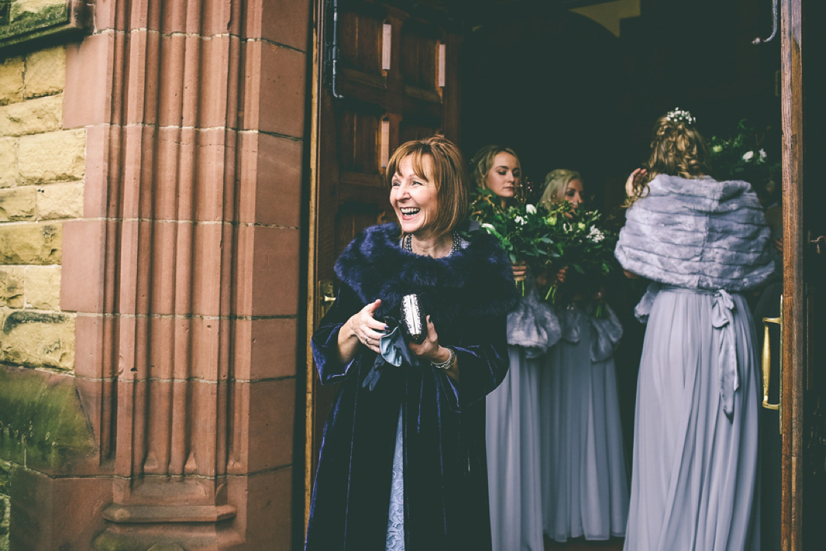 Jess wears an Eliza Jane Howell dress for her winter village hall wedding. Photography by Emma Boileau.