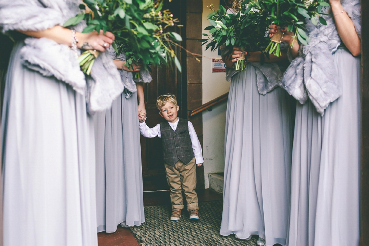 Jess wears an Eliza Jane Howell dress for her winter village hall wedding. Photography by Emma Boileau.