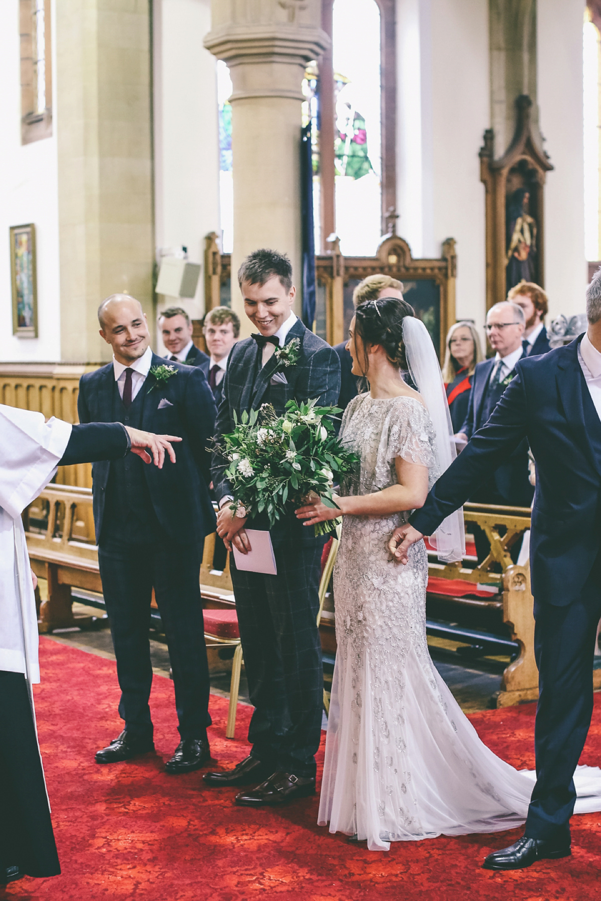 Jess wears an Eliza Jane Howell dress for her winter village hall wedding. Photography by Emma Boileau.