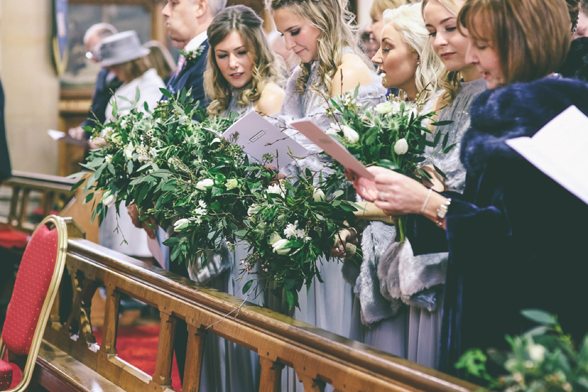 Jess wears an Eliza Jane Howell dress for her winter village hall wedding. Photography by Emma Boileau.