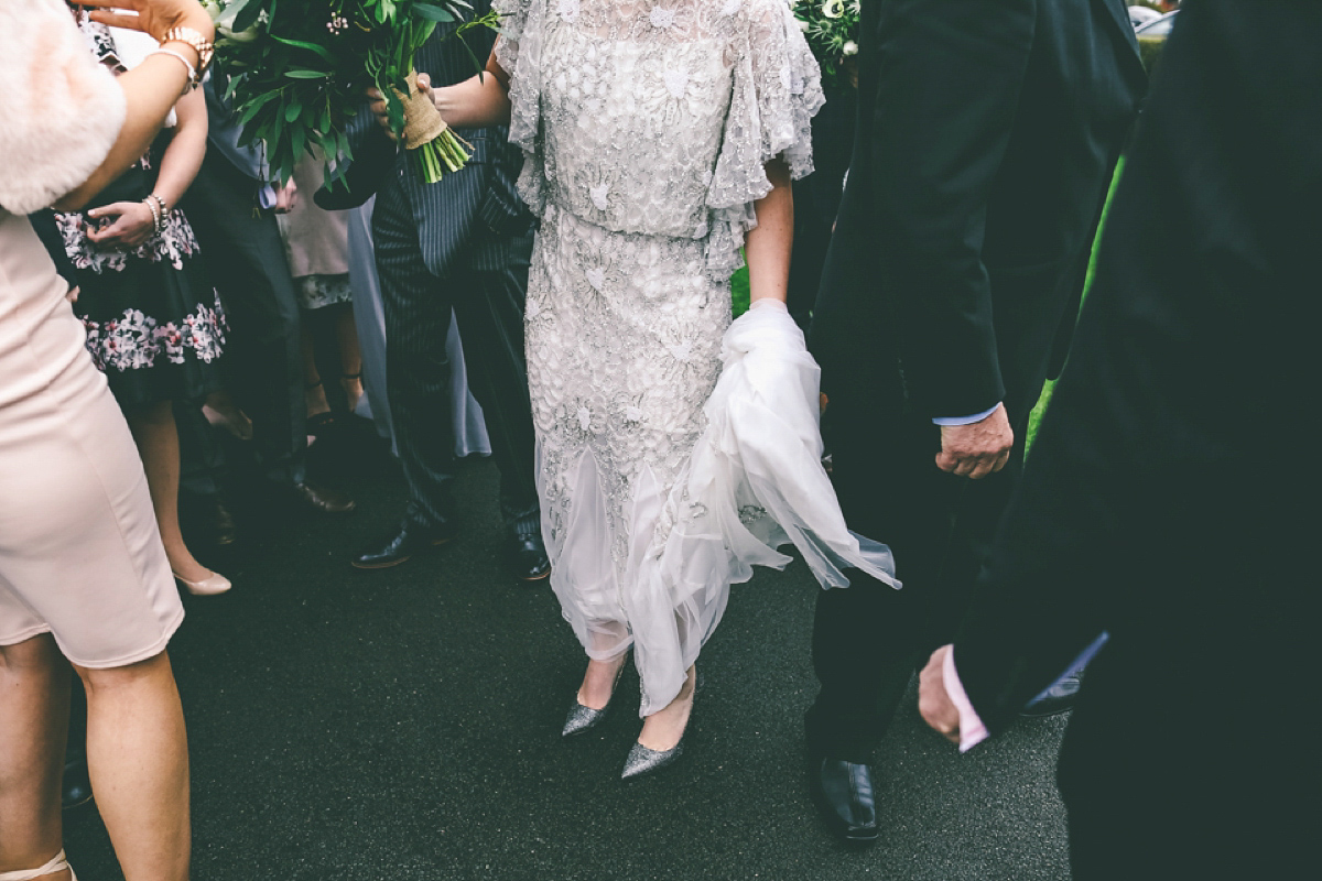 Jess wears an Eliza Jane Howell dress for her winter village hall wedding. Photography by Emma Boileau.